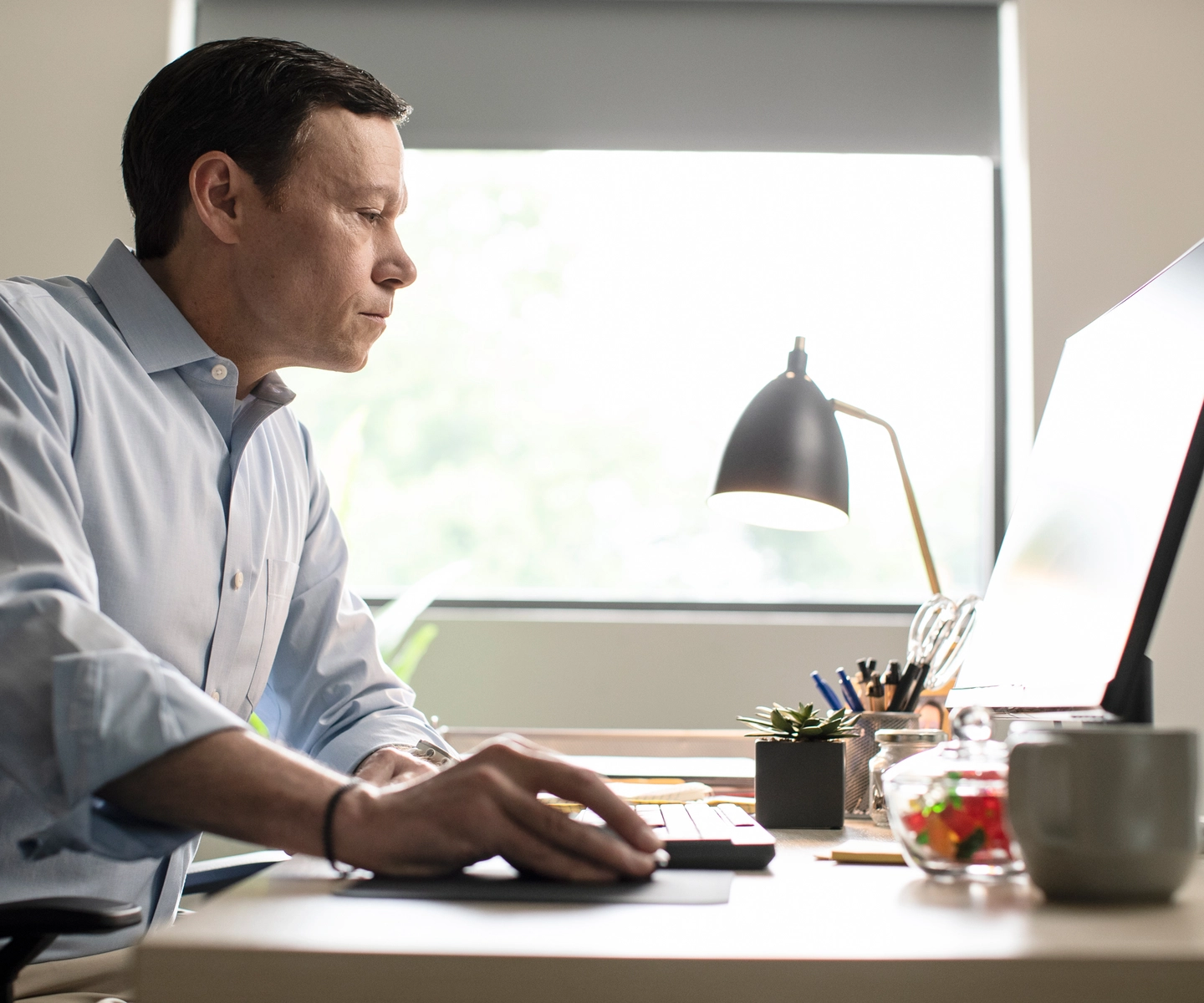 Man working on his desktop computer
SERV1444 Three Year usage. Limited to Internal use at corporate on digital, social and website, with three yea print usage beginning 10/1/2021